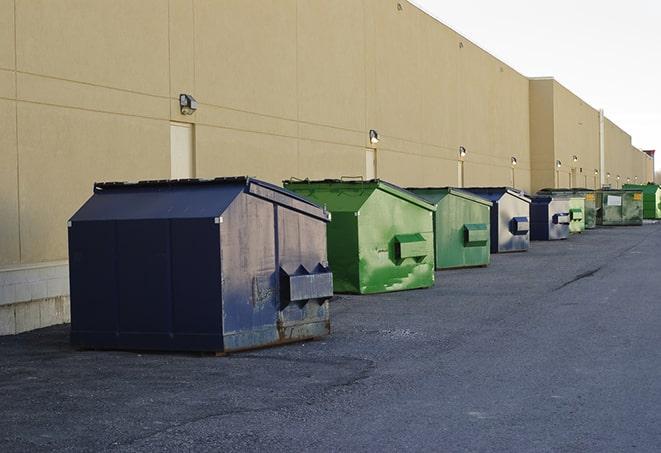 brightly colored dumpsters filled with construction waste in Cooper City FL